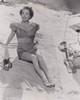 Joan Crawford - Sitting on Beach Towel Photo Print (8 x 10) - Item # DAP18702