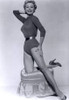 Mitzi Gaynor - Kneeling on Ottoman Photo Print (8 x 10) - Item # DAP18925