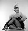 Mitzi Gaynor - Sitting Legs Folded Woth Feather Boa Photo Print (8 x 10) - Item # DAP19043