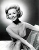 Mitzi Gaynor - Sitting on Couch Photo Print (8 x 10) - Item # DAP18987
