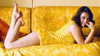 Natalie Wood - Laying on Stomach on Yellow Couch Photo Print (10 x 8) - Item # DAP19873