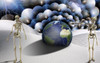 Surreal desert with skeletons and globe. Lightning in the sky. Poster Print by Bruce Rolff/Stocktrek Images - Item # VARPSTRFF200301S