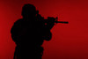 Silhouette of a U.S. Marine Corps Marsoc raider aiming gun, red background. Poster Print by Oleg Zabielin/Stocktrek Imag - Item # VARPSTZAB102132M