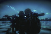 Special forces soldiers with rifle in action during a river raid in the jungle under the cover of darkness. Poster Print - Item # VARPSTZAB102771M