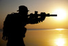Silhouette of Army soldier with rifle against an orange sunset. Poster Print by Oleg Zabielin/Stocktrek Images - Item # VARPSTZAB102866M