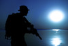 Silhouette of Army soldier with rifle under the cover of darkness and moonlight. Poster Print by Oleg Zabielin/Stocktrek - Item # VARPSTZAB102869M