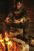 Special forces soldier warming his hands over a fire in a ruined building. Poster Print by Oleg Zabielin/Stocktrek Image - Item # VARPSTZAB103043M