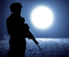 Black silhouette of soldier at night under moonlight. Poster Print by Oleg Zabielin/Stocktrek Images - Item # VARPSTZAB103074M