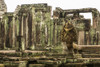 Statue in foreground of ruined Bayon temple, Angkor Wat; Siem Reap, Siem Reap Province, Cambodia Poster Print by Nick Dale / Design Pics - Item # VARDPI12545290