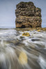 Water washing over the rocks on the shore by a large sea stack; South Shields, Tyne and Wear, England Poster Print by Philip Payne / Design Pics - Item # VARDPI12435750