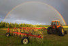 A rainbow appears in the sky over a tractor which has just raked a field of hay; Delta Junction, Alaska. United States of America Poster Print by Steven Miley / Design Pics - Item # VARDPI12434956