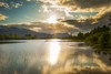 The calm waters on a unnamed lake in Portage Valley on a sunny, summer evening as the sun sets in South-central Alaska; Alaska, United States of America Poster Print by Michael Jones / Design Pics - Item # VARDPI12548464
