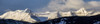 Panorama Of Snow Covered Mountains With Early Morning Light, Silhouetted Forest In The Foreground, Blue Sky And Clouds; Kananaskis Country, Alberta, Canada Poster Print by Michael Interisano / Design Pics - Item # VARDPI12325968