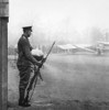 Magic lantern slide WW1 1914-1918 World war one images Soldier standing guard Standing a gun Fokker aircraft torpedoes background Display captured German weapons artillary Horse Guards Parade London 3rd November 1915 John Short # VARDPI12511004