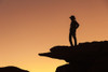 Man standing on rock surveying the view.  Poster Print by Brenda Tharp - Item # VARPDDUS45BTH0026