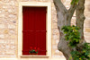 Dark red shutters in the wall of a house in France. Poster Print by Tom Haseltine - Item # VARPDDEU09THA0010