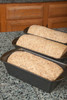 Three bread pans of multigrain dough ready for final rising Poster Print by Janet Horton (18 x 24) # US48JHO1153