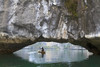 Ha Long Bay, Vietnam. View of kayaker through limestone arch. Poster Print by Yvette Cardozo - Item # VARPDDAS38YCA0033