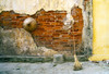 Still-life of a hat and broom against a weathered wall in Vietnam. Poster Print by Tom Haseltine - Item # VARPDDAS38THA0082