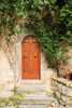 Italy, Tuscany, Greve in Chianti. Chianti vineyards. Stone farm house entrance door. Poster Print by Emily Wilson - Item # VARPDDEU16EWI0497
