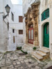 Italy, Puglia, Brindisi, Itria Valley, Ostuni Green door and a red door surrounded by very ornate carvings along the streets and alleyways of old town Ostuni Poster Print by Julie Eggers (18 x 24) # EU16JEG0682