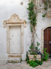 Italy, Puglia, Brindisi, Itria Valley, Ostuni Ornate carvings surrounding the doors and potted plants in the alleys and narrow streets of the white city of Ostuni Poster Print by Julie Eggers (18 x 24) # EU16JEG0671