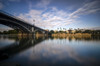 Reflection of a river and Guadalquivir bridge at dusk; Seville, Andalucia, Spain Poster Print by Rick Senley (19 x 13) # 13381897
