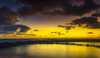 Golden sunrise over Lydgate Park and the ocean from the coast of Kauai with a silhouetted breakwater; Kapaa, Kauai, Hawaii, United States of America Poster Print by The Nature Collection (20 x 11) # 12575063
