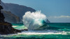 Large ocean wave crashes into rock along the Na Pali Coast; Kauai, Hawaii, United States of America Poster Print by The Nature Collection (20 x 11) # 12574188