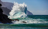 Large ocean wave crashes into rock along the Na Pali Coast; Kauai, Hawaii, United States of America Poster Print by The Nature Collection (19 x 12) # 12574191