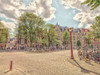 Bicycle parked on the street by Assaf Frank (24 x 18)