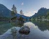 Lake Hintersee with mountains and trees growing on small, rock island at dawn at Ramsau in the Berchtesgaden National Park in Upper Bavaria, Bavaria, Germany Poster Print by Raimund Linke (17 x 14)