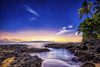 Landscape in a Hawaiian paradise in Makena Cove at sunset with rugged rocks and lush vegetation lining the shoreline, and stars in the clear sky; Maui, Hawaii, United States of America Poster Print by Living Moments Media (20 x 13)