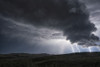 Lightning strikes from a passing supercell thunderstorm; Saskatchewan, Canada Poster Print by Robert Postma (18 x 12)
