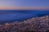 Overview of Cape Town city skyline and shoreline along the Atlantic Ocean coast at dusk; Cape Town, Western Cape Province, South Africa Poster Print by Alberto Biscaro (20 x 13)