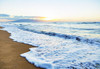 The sea surf foams as it rolls onto a beach with a view of the Island of Lanai and clouds in the distance at sunset; Ka'anapali, Maui, Hawaii, United States of America Poster Print by LJM Photo (18 x 12)
