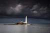 White Lighthouse Illuminated By Sunlight Under Dark Storm Clouds; St. Mary's Island Northumberland England Poster Print by John Short (19 x 12) White Lighthouse Illuminated By Sunlight Under Dark Storm Clouds; St. Mary's Island Northumberland England Poster Print by John Short (19 x 12)