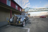 Vintage American automobile outside the Cannery Pier Hotel by the Astoria-Megler Bridge. Poster Print by Loop Images Ltd. (20 x 13)