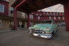A vintage American car parked outside the Cannery Pier Hotel. Poster Print by Loop Images Ltd. (20 x 13)