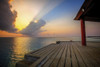 Sunrise cloudburst seen from the end of a boat jetty in the Maldives. Poster Print by Loop Images Ltd. (20 x 13)