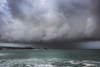 Dramatic sky over Fistral Bay in Newquay in Cornwall. Poster Print by Loop Images Ltd. (20 x 13)