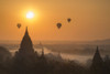 Hot air balloons flying over temples on a misty morning at Bagan. Poster Print by Loop Images Ltd. (18 x 11)