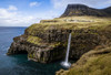 A waterfall cascades down a dramatic rockface on the Faroe Islands. Poster Print by Loop Images Ltd. (19 x 13)
