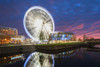 Liverpool ferris wheel and arena reflected at night with apocalyptic sky in Liverpool. Poster Print by Loop Images Ltd. (18 x 12)