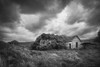 Black and white image of a spooky old abandoned house under threatening weather clouds in Eastern Washington, USA; Colfax, Washington, United States of America Poster Print by Doug Ogden (20 x 13)