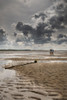A single boat sitting on the sand at low tide at Morston in Norfolk. Poster Print by Loop Images Ltd. (13 x 19)