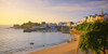 Sandy beach leading to the harbour in the seaside town of Tenby. Poster Print by Loop Images Ltd. (20 x 10)