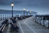 Benches under lamps along Swanage pier at twilight. Poster Print by Loop Images Ltd. (17 x 11)