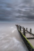 The sea defences at Overstrand on the North Norfolk coast at sunrise. Poster Print by Loop Images Ltd. (13 x 20)