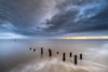 The sea defences at Overstrand on the North Norfolk coast at sunrise. Poster Print by Loop Images Ltd. (20 x 13)